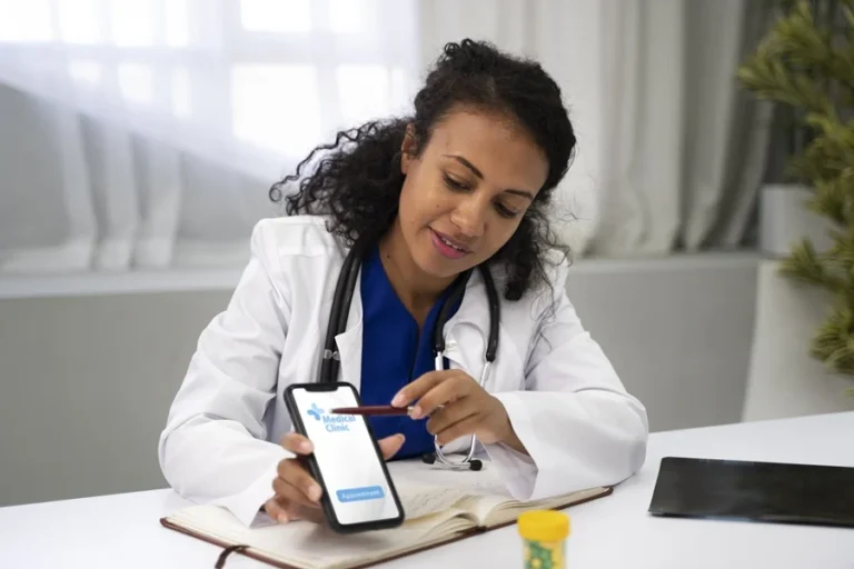 medium-shot-doctor-holding-smartphone.jpg